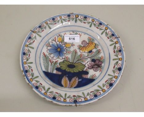 Antique tin glazed Delftware plate with floral painted decoration, 9.25ins diameter 