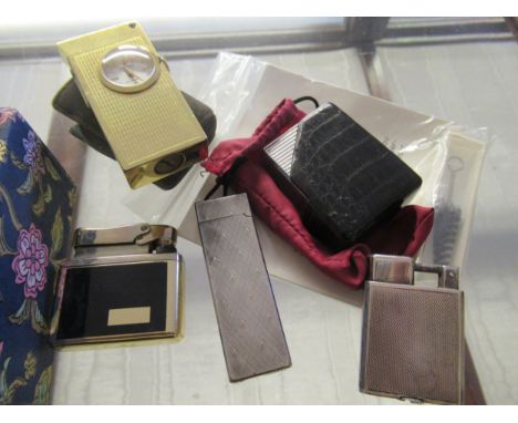 Small sterling silver cigarette lighter, together with four other cigarette lightersSome small dents to the base, otherwise i