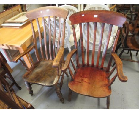 Two early 20th Century stick back oak and elm kitchen elbow chairs on turned supports 