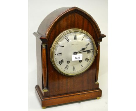 Early 20th Century mahogany lancet shaped mantel clock, the circular silvered dial with Roman numerals, signed Maple & Co. Lt