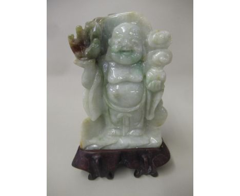 Small 20th Century celadon jade figure of a standing Buddha, 9cm high with hardwood stand 