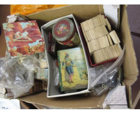 Box containing a quantity of various childrens games and toys including a bone and ebony domino set, cribbage board etc 