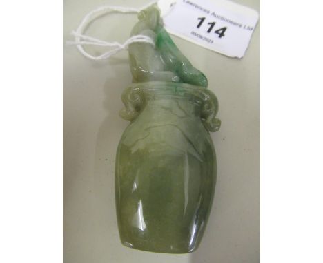 Small 20th Century two colour green jade carving in the form of a two handled vase, 9cm high overall 
