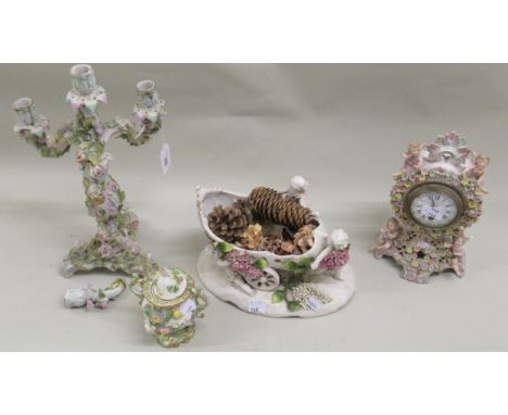 Continental porcelain and floral encrusted four light candelabra (at fault), 34cms high, together with a vase in the form of 