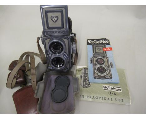 Rolleiflex twin lens camera in two tone grey with original outer case, instruction manuals and a small quantity of accessorie