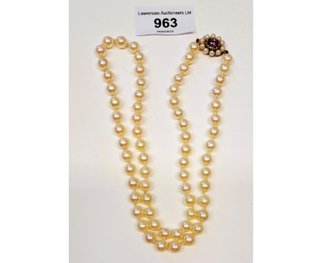 Single row uniform cultured pearl necklace with a 9ct gold amethyst set clasp 