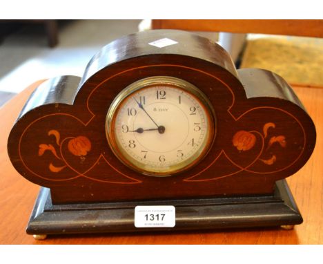 Early 20th Century mahogany dome top mantel clock with three train movement striking on gongs, together with an Edwardian mah