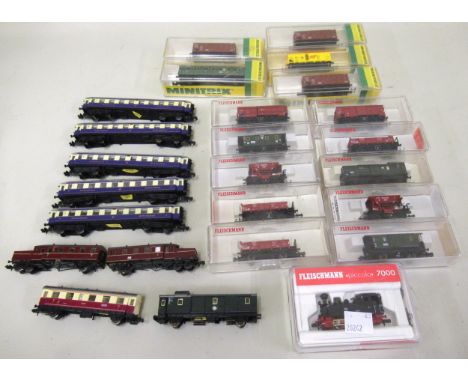 Collection of Fleischmann Piccolo rolling stock with locomotive, numbered 7000, in original boxes, also includes some Minitri