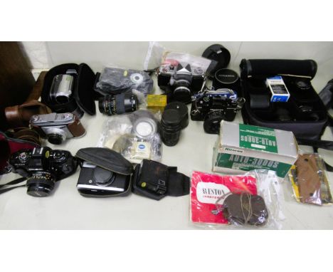 Box containing a large collection of various SLR cameras and camcorders, including Praktica, Kodak, Canon, Super 8 cine camer
