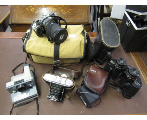 Pentax ME Super 35mm camera with lenses, together with a cased pair of binoculars, Polaroid camera and another 
