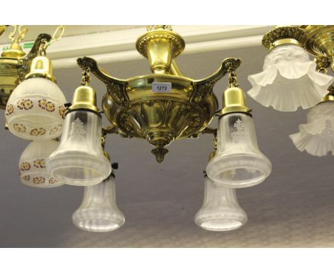 American brass hanging ceiling light fitted with four frosted and etched glass shadesGood overall condition 