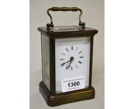 Small brass cased carriage clock, the enamel dial with Roman numerals and single train movement, signed to the back plate Mat