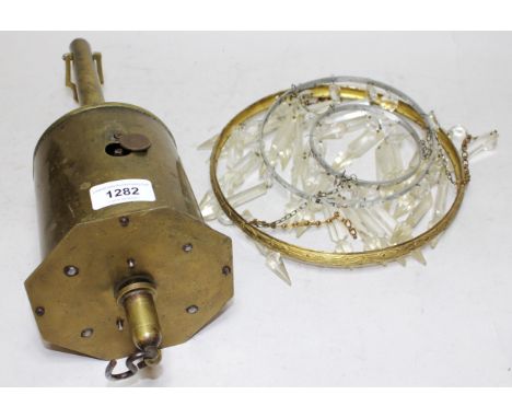 Brass spit jack and a three tier cut glass bag form light fitting 