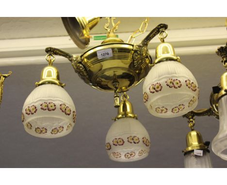 Brass three branch hanging light fitting with opaque floral and painted shades 