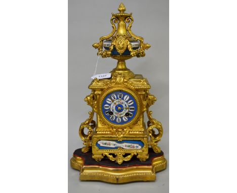 Good quality 19th Century French gilded spelter and porcelain two train mantel clock with a gilded composition plinth, pendul