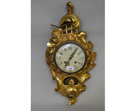 Late 19th / early 20th Century Continental carved giltwood cartel clock with enamel dial, Arabic numerals and two train movem
