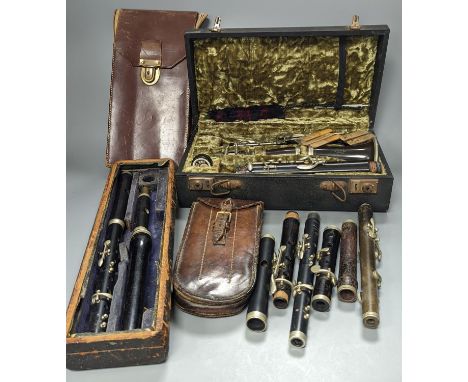 Three ebony or rosewood flutes and a clarinet