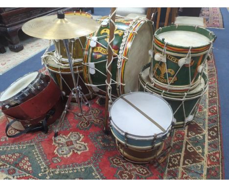 A collection of painted wood drums from Warningham troop, probably ex. military, together with leather straps sheet music pou