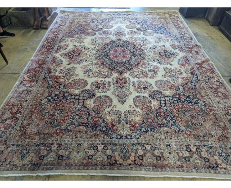 A North West Persian ivory ground carpet, 410 x 310cm