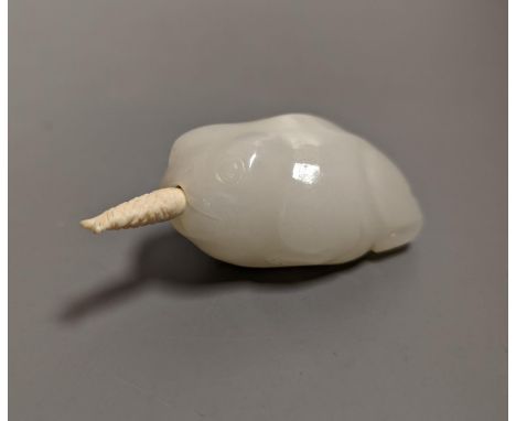 A Chinese white jade 'toad' snuff bottle, the stone of excellent even tone, 8cms long, including stopper