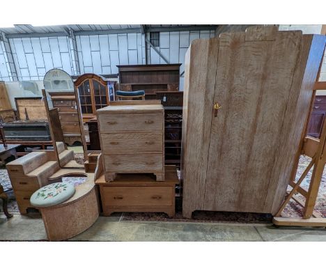 An Art Deco style limed oak three piece bedroom suite and a similar low chest, wardrobe width 108cm depth 51cm height 185cm
