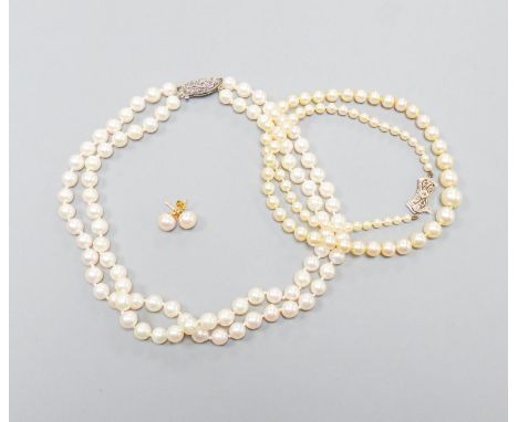 A single strand graduated cultured pearl necklace, with diamond set 9ct clasp, 43cm, a double strand cultured pearl choker ne