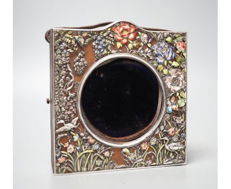 An early 20th century Japanese? white metal and polychrome enamel mounted leather travelling watch case, decorated with flowe