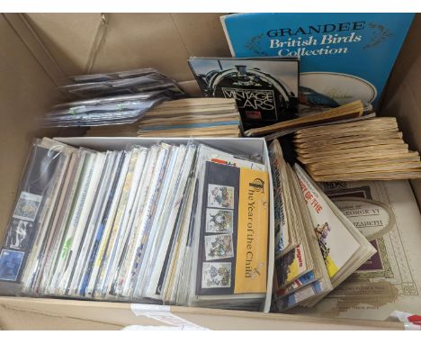 A quantity of First Day Covers and cigarette cards