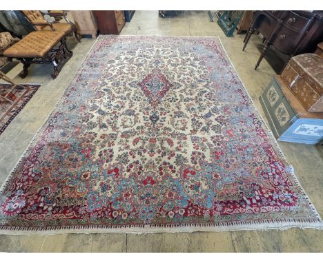 A North West Persian ivory ground carpet, 396 x 290cm