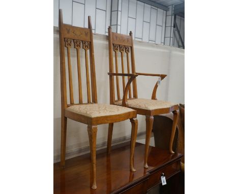 A pair of Art Nouveau inlaid mahogany chairs, one with arms