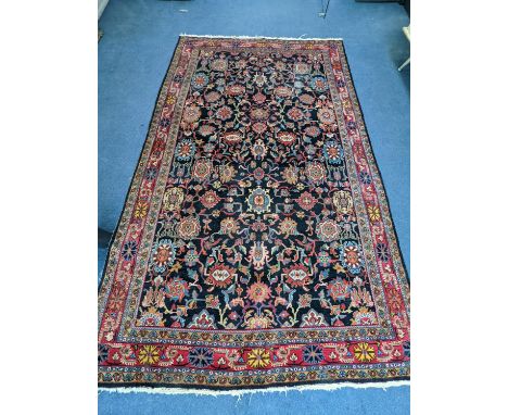 A Heriz / Moghal blue ground carpet, 340 x 206cm