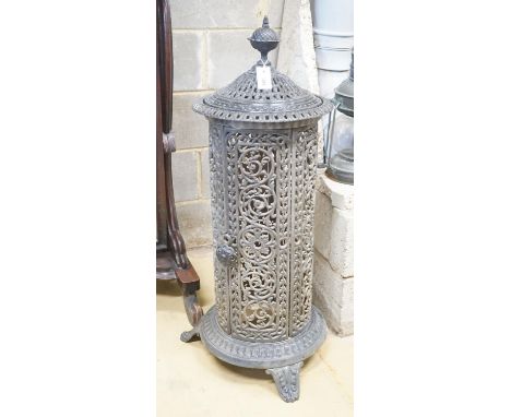 A French pierced enamel cylindrical cast iron conservatory heater, height 110cm