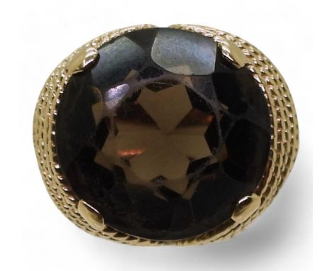 A 14k gold smoky quartz ring, size K1/2, weight 6.8gms Condition Report:Available upon request