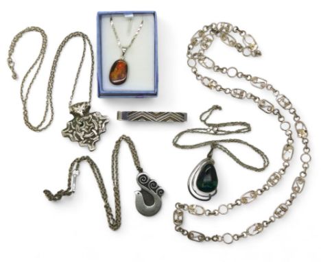 A silver Georg Jensen tie slide pattern 77, a silver mounted ammolite pendant, a pewter dove pendant by Swedish jeweller R. T