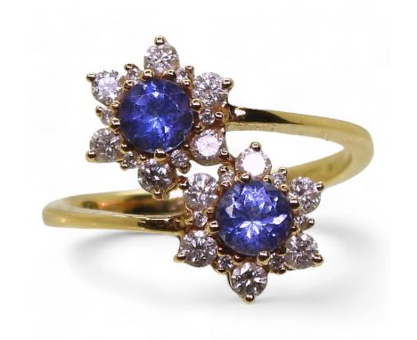 An 18ct gold twin flower ring, set with tanzanites and diamonds, set with estimated approx 0.40cts of brilliant cut diamonds,