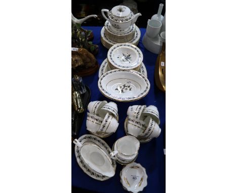 A Royal Worcester Bernina pattern dinner service comprising plates, bowls, serving dishes, cups and saucers, teapot, milk jug