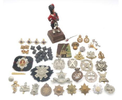 A collection of military cap badges, to include the 96th Regiment of Foot, Black Watch (Royal Highlanders), Royal Tank Regime