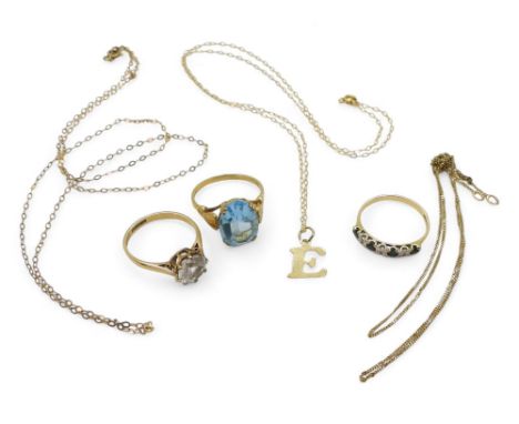 A collection of 9ct gold and yellow metal, blue gem and diamond ring, size N, a clear gem solitaire ring, size N1/2, and a bl