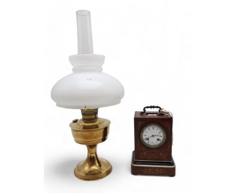 A French inlaid wooden clock, the dial marked Andre a Paris, together with a brass oil lamp Condition Report:Available upon r