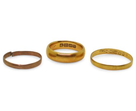 A 22ct gold court wedding ring with Birmingham hallmarks for 1918, size N, a further example dated Birmingham 1889 size U, we