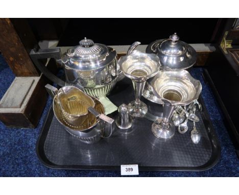 A collection of EPNS including a tea caddy, a three piece tea service, specimen vases etc Condition Report:Available upon req