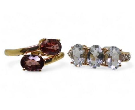 A 9ct gold aquamarine and white zircon ring, size J1/2, together with a 9ct Zanzibar zircon ring, size M, weight together 4.6