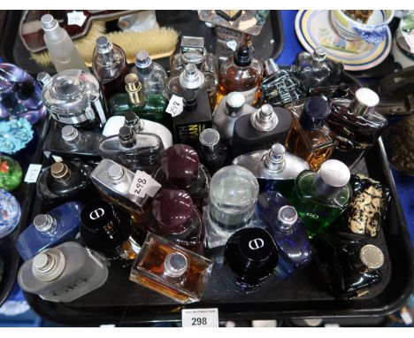 A collection of men's aftershave, some testers including Sauvage, Dolce and Gabbana, Diesel, Lacoste, Invictus, Giorgio Arman
