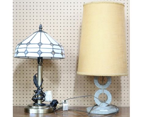 A lot comprising a 20th century metallic based table lamp with Tiffany style shade and another stone based lamp with upholste