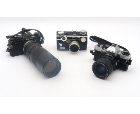An Olympus OM-2 camera fitted with a Misuki MC Macro 75-260mm 1:4.5 lens and OM10 camera fitted with an RMC Tokina 35-70mm 1: