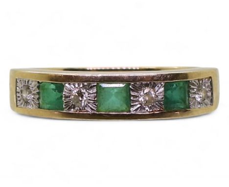 A 9ct gold emerald and illusion set diamond eternity ring, size I1/2, weight 2.6gms Condition Report:Available upon request