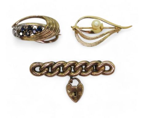 A 9ct gold sapphire and diamond brooch, a 9ct vintage brooch with a padlock and chain design and a further yellow metal faux 