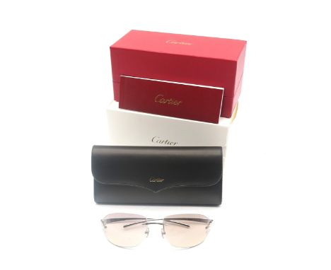 A pair of Cartier sunglasses, with protective case and retaining original packaging&nbsp; Condition Report:Available upon req