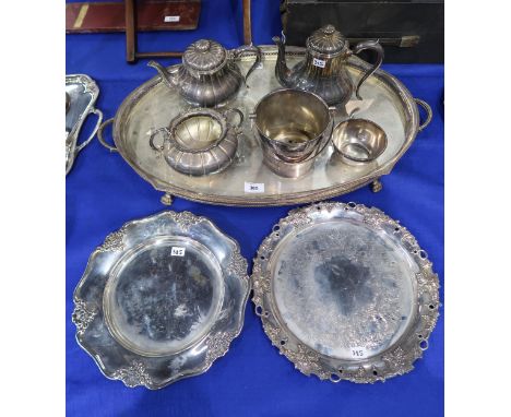 A large EPNS serving tray, with openwork gallery, on four paw feet, a three piece tea service, two plates etc Condition Repor