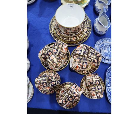 A Royal Crown Derby tea and coffee wares comprising six 2451 pattern tea cups and saucers, plates, cake plate and sugar bowl,